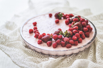 Sweet homemade tart with berries on grey table