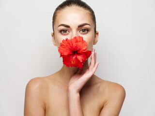 Fototapeta na wymiar woman naked shoulders red flower mouth glamor cosmetics