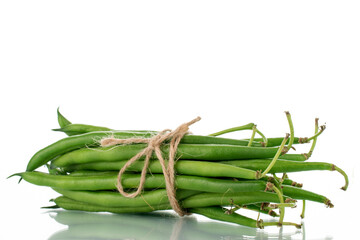 Several ripe green beans, close-up, isolated on white.