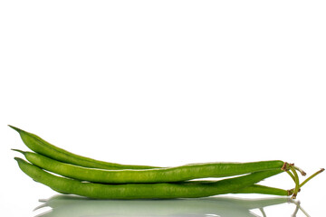 Several ripe green beans, close-up, isolated on white.