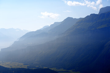 Fototapeta premium Panoramic view of Haslital (Hasli Valley) from mountain Brienzer Rothorn at Bernese Highland on a beautiful sunny summer day. Photo taken July 21st, Flühli, Switzerland.