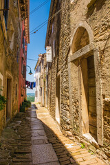 Fototapeta na wymiar A residential road in the historic medieval hill village of Buje in Istria, Croatia 