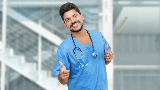 Happy hispanic male nurse with beard