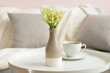 Draagtas Vase with lily-of-the-valley flowers and cup of coffee on table at home © Pixel-Shot