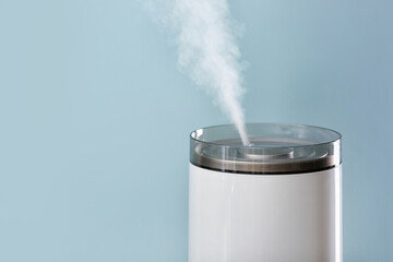 Modern humidifier on color background, closeup