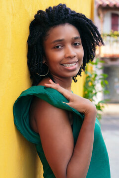 Close upside portrait of beautiful smiling young Black woman lea