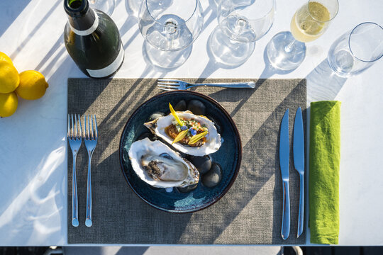 Oyster's dish paired with champagne at outdoor high cuisine rest