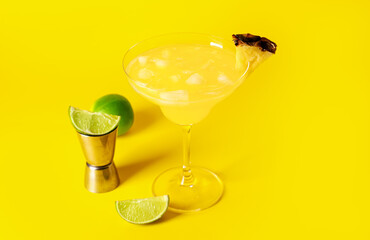 Glass of pineapple daiquiri cocktail on color background