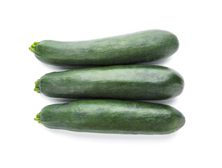 Fresh zucchini squashes on white background
