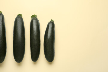 Fresh zucchini squashes on color background