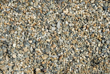 Stones of a Mediterranean beach smoothed by the sea.
