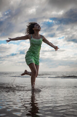 girl jumping on the beach