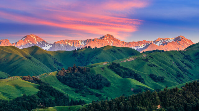 Nalati grassland with beautiful mountain landscape at sunset in Xinjiang,China.