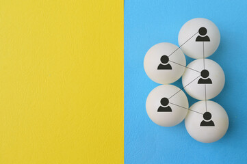 People symbol connected with lines isolated on blue and yellow background