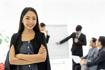 Portrait of smiling Asian business woman meeting at work in the office