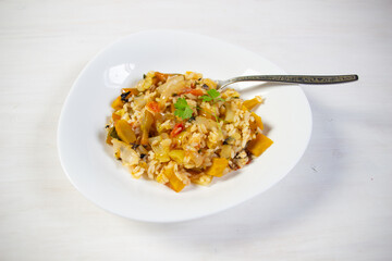 spicy rice with chilli, vegetables in bowl on white background
