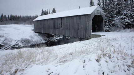 covered bridge in snow