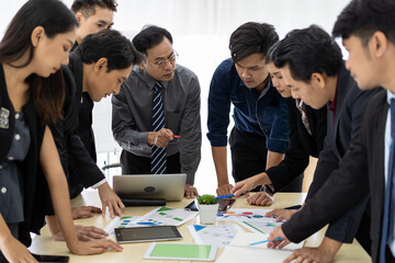 Group of Asian colleagues meeting in the office. Business team or business partners sharing or brainstorming ideas together. business, people, investment concept