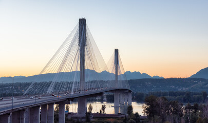 Port Mann Bridge over the Fraser River. Sunny Summer Sunset. Surrey, Vancouver, British Columbia,...