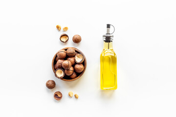 Macadamia essence oil with macadamia nuts. Organic product for food or cosmetic