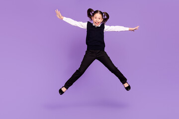 Photo of cheerful careless dreamer schoolgirl jump enjoy flight wear uniform isolated purple color background