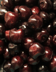 close up of cherries on white background