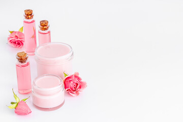 Skin care products with roses. Essential oil and liquid for spa treatment