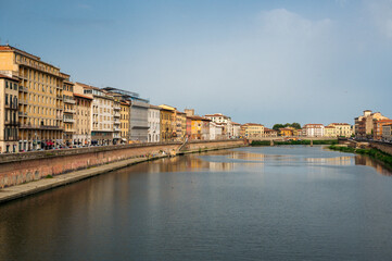 Fototapeta na wymiar river arno flowing through the oldtown of Pisa, Tuscany