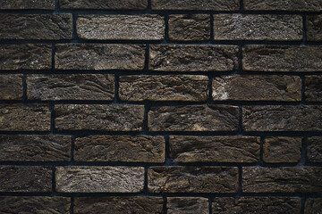 Brick wall made of textured decorative brick.