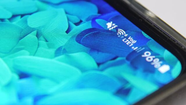 5G transformation, high speed connectivity, and smart city concept. Smartphone showing Wi-Fi 6 logo. Wi-Fi 6 provide high speed wireless connectivity to user equipment. 