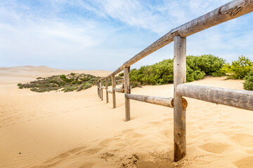 Wooden fence in the Sand dunes at Pismo beach in California, USA