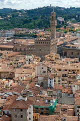 Fototapeta na wymiar Red rooftops of Florence with the Palazzo Vecchio