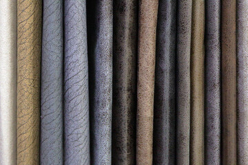 Multicolored leatherette is hanging in the store.