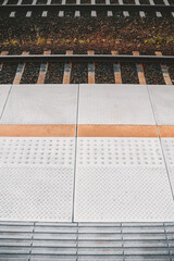 Train platform with tactile dotted pavement for handicapped people. City transportation...