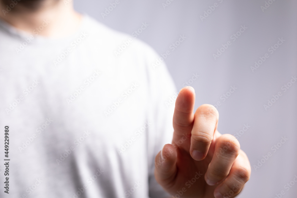 Poster Hand pushing on a touch screen..