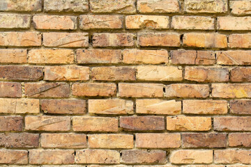 brick wall with different yellow tones 