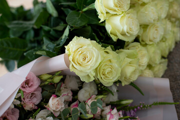 bouquets of mixed flowers the work of the florist at a flower shop. Delicate Pastel color. Fresh cut flower. Green and pink color