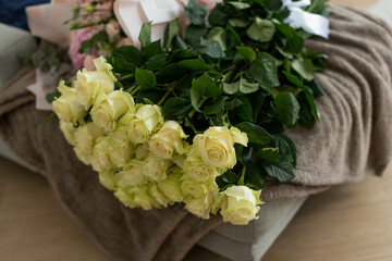 bouquets of mixed flowers the work of the florist at a flower shop. Delicate Pastel color. Fresh cut flower. Green and pink color