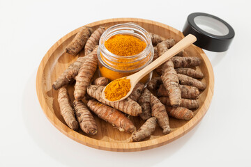 Fresh organic root and turmeric powder - Curcuma longa; Healthy Food.