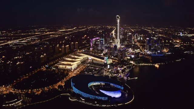 CBD buildings by Jinji Lake at night in Suzhou, China.