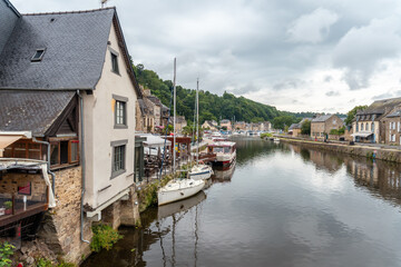 Fototapeta premium Houses and boats on the Rance river in Dinan medieval village in French Brittany, France