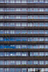 A urban pattern reflecting a clear and cloudy sky