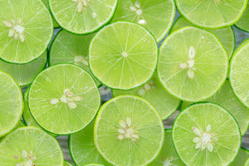Fototapeta na wymiar Macro Lime,Fresh lime slices as a background.