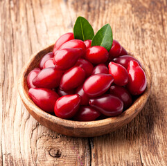 Sweet dogberry in wooden plate