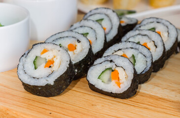 Vegetarian sushi maki with rice, cucumber, carrot and egg