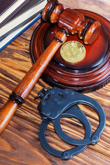 bitcoin, judge's hammer, handcuffs. Concept bitcoin ban, violation of the law.