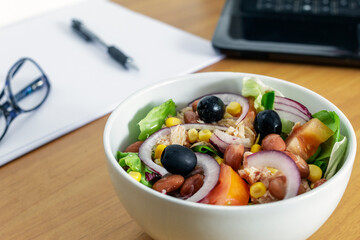 A salad in a white porcelain bowl