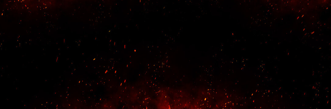 Fire embers particles over black background. Fire sparks background. Abstract dark glitter fire particles lights.	
