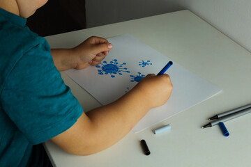 Little boy drawing coronavirus. Covid-19 virus and kids