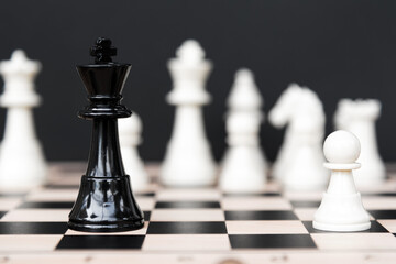 Black King Chess and White Pawn Chess on Black Background